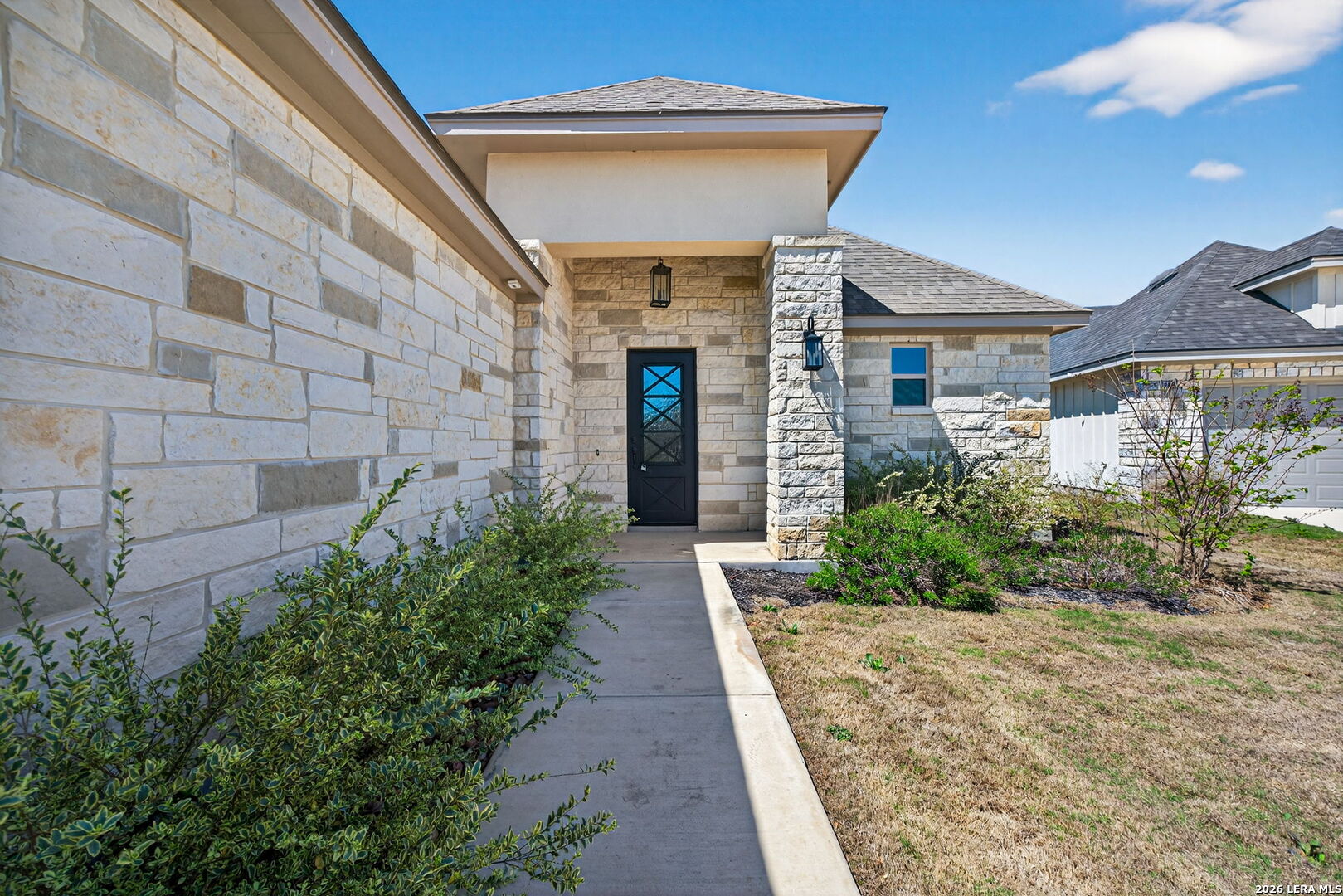 123 John T Court Castroville, TX 78009 - Photo 6 of 45 a front view of a house with a yard