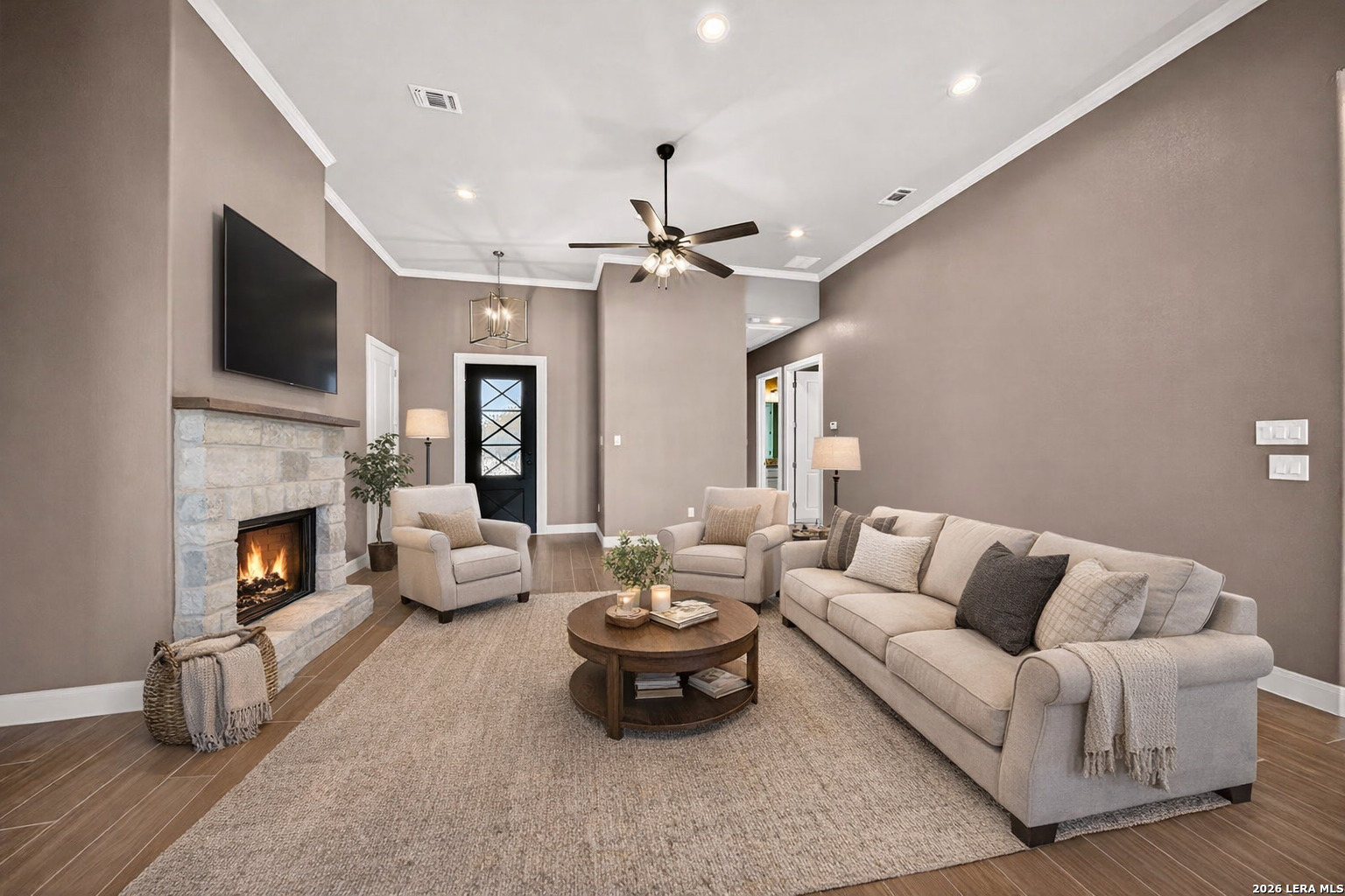 123 John T Court Castroville, TX 78009 - Photo 8 of 45 a living room with furniture fireplace and a flat screen tv
