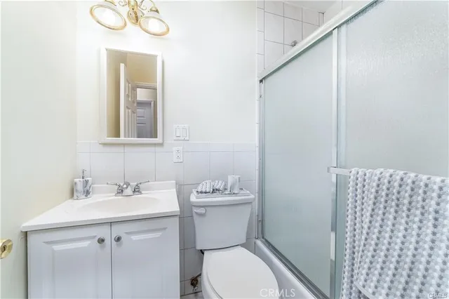 a bathroom with a sink toilet and vanity