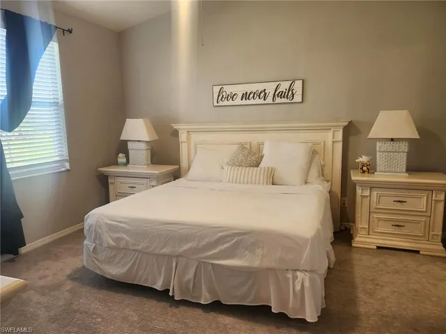 a bedroom with a bed and dresser