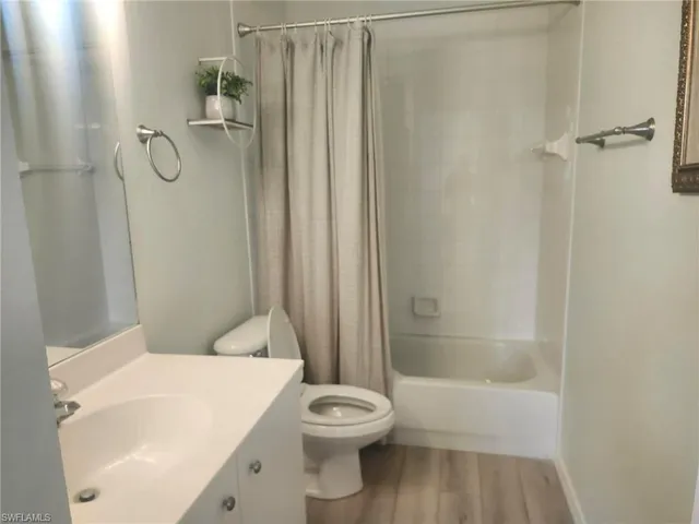 a bathroom with a toilet and shower