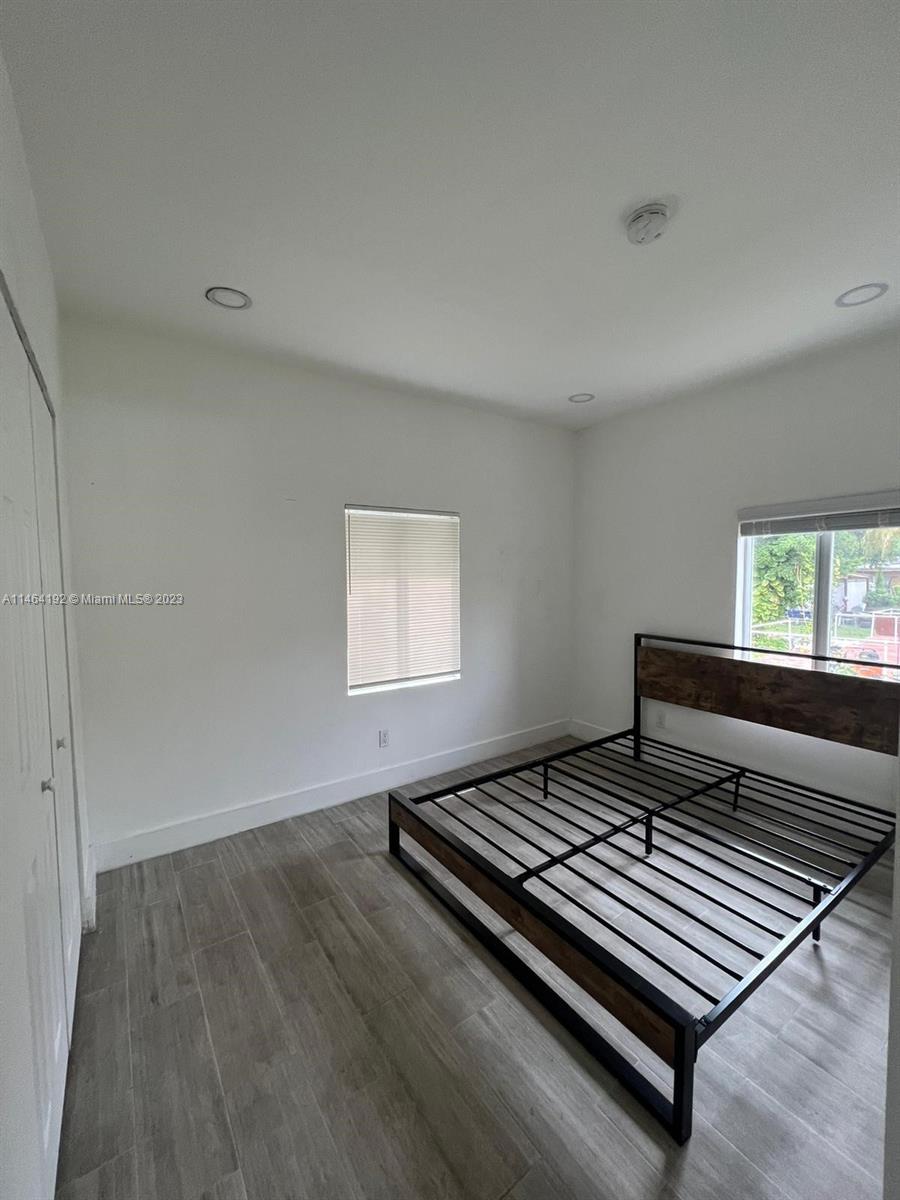 Santa Clara Miami, FL 33127 - Photo 11 of 14 a view of a room with wooden floor and window