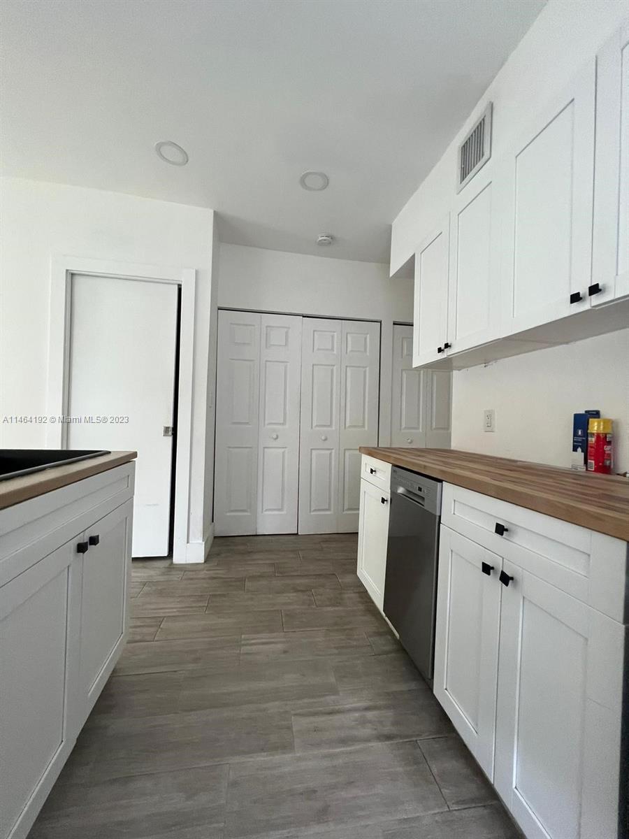 Santa Clara Miami, FL 33127 - Photo 3 of 14 a view of cabinets with wooden floor