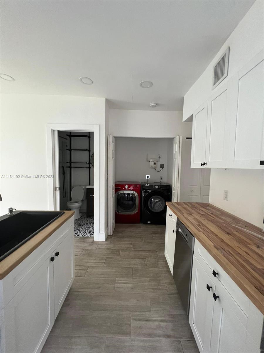 Santa Clara Miami, FL 33127 - Photo 4 of 14 a kitchen that has a sink and a stove