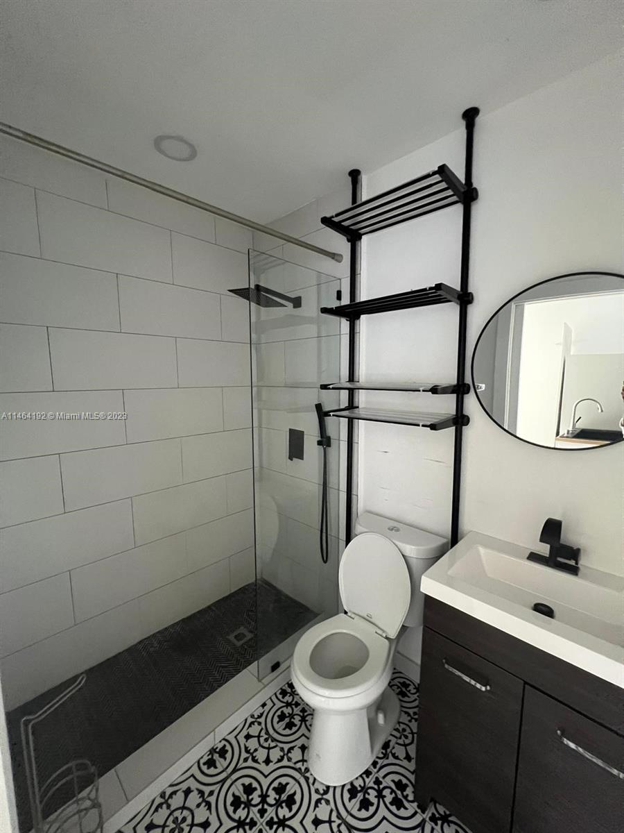 Santa Clara Miami, FL 33127 - Photo 9 of 14 a bathroom with a toilet a sink and shower