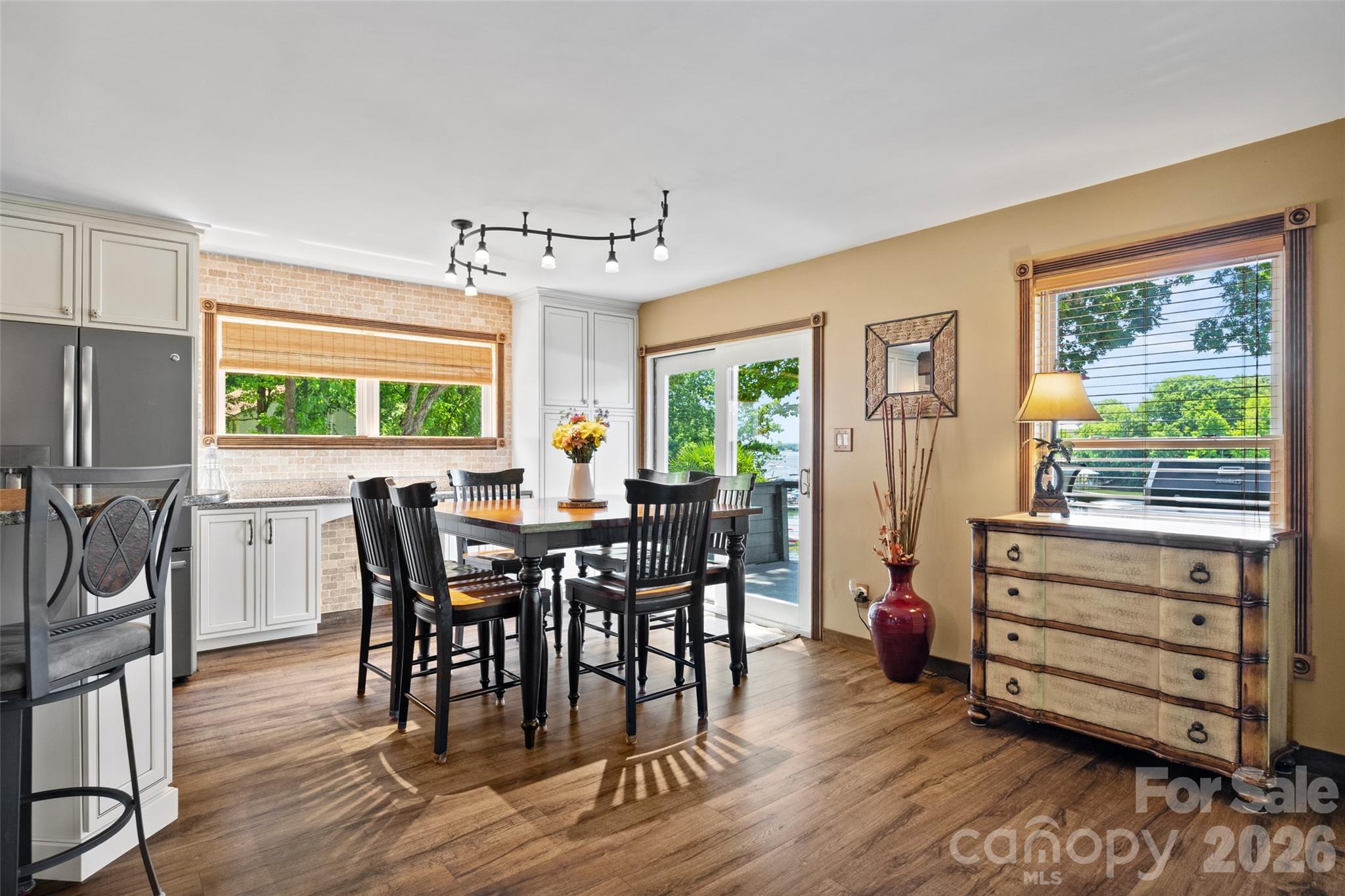 27056 Catamaran Drive Tega Cay, SC 29708 - Photo 12 of 48 a view of a dining room with furniture window and wooden floor
