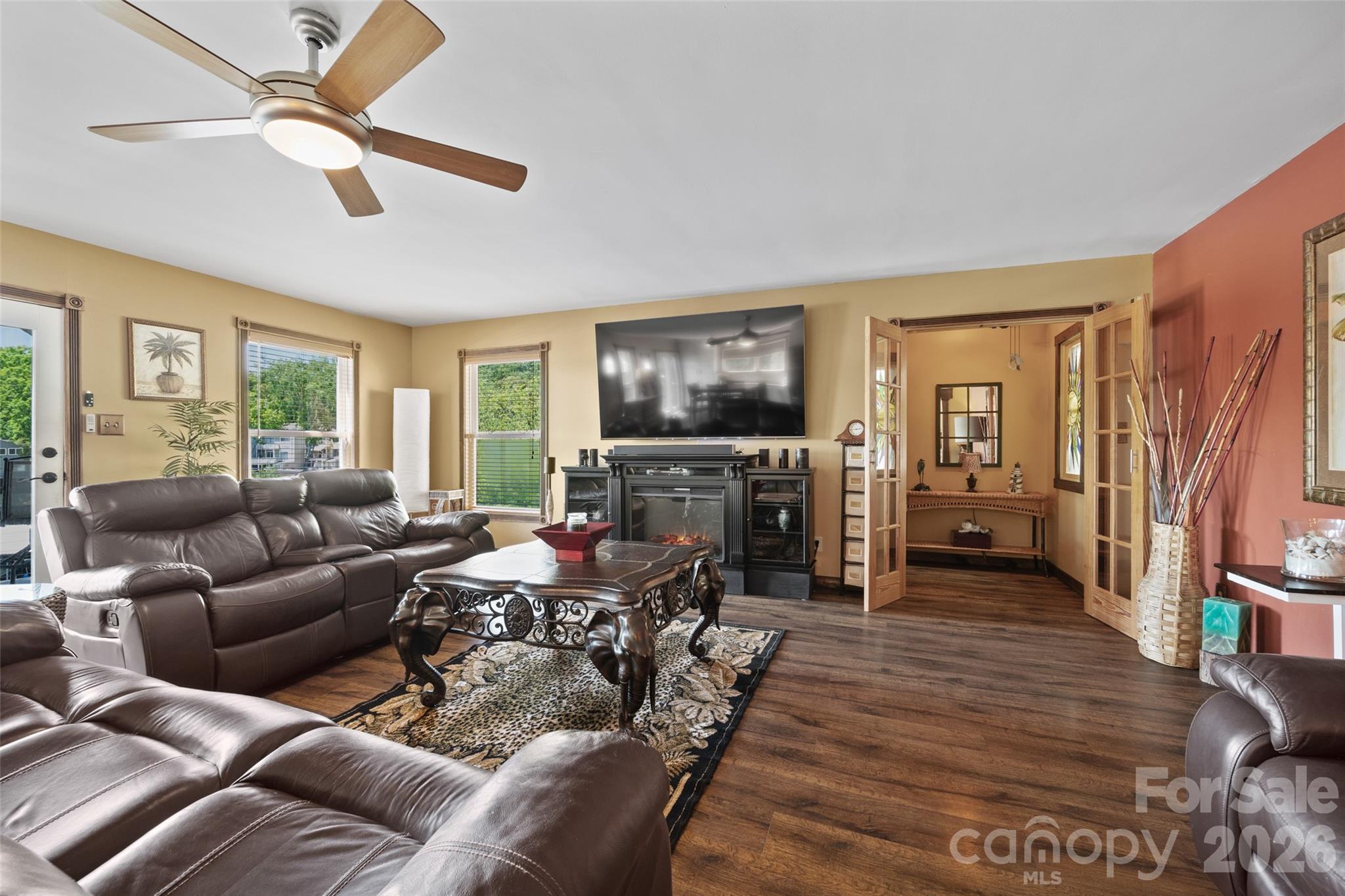 27056 Catamaran Drive Tega Cay, SC 29708 - Photo 15 of 48 a living room with furniture and a flat screen tv