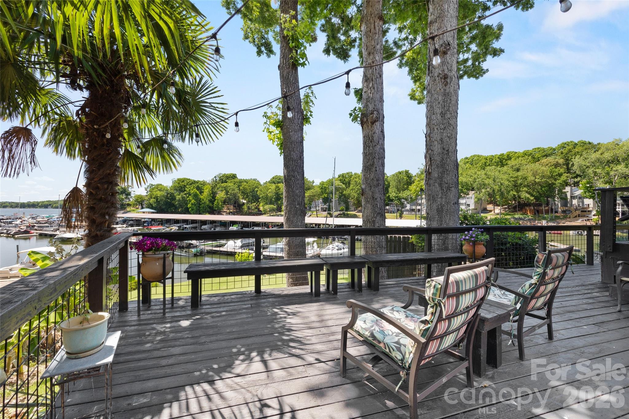 27056 Catamaran Drive Tega Cay, SC 29708 - Photo 18 of 48 a view of a swimming pool with a patio and a garden