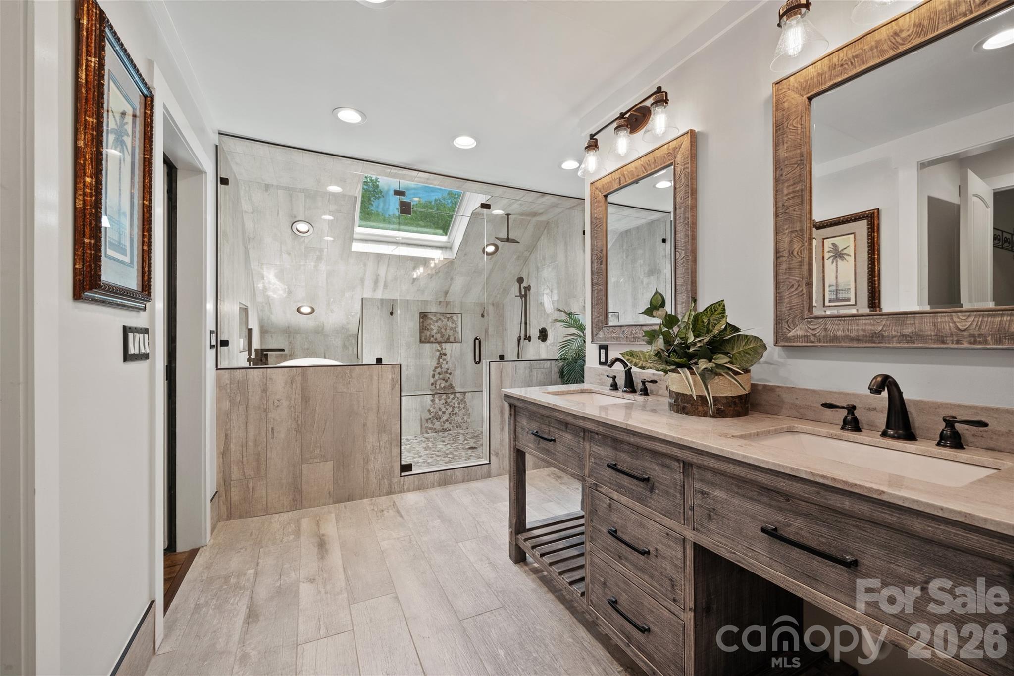 27056 Catamaran Drive Tega Cay, SC 29708 - Photo 22 of 48 a bathroom with a double vanity sink mirror and shower