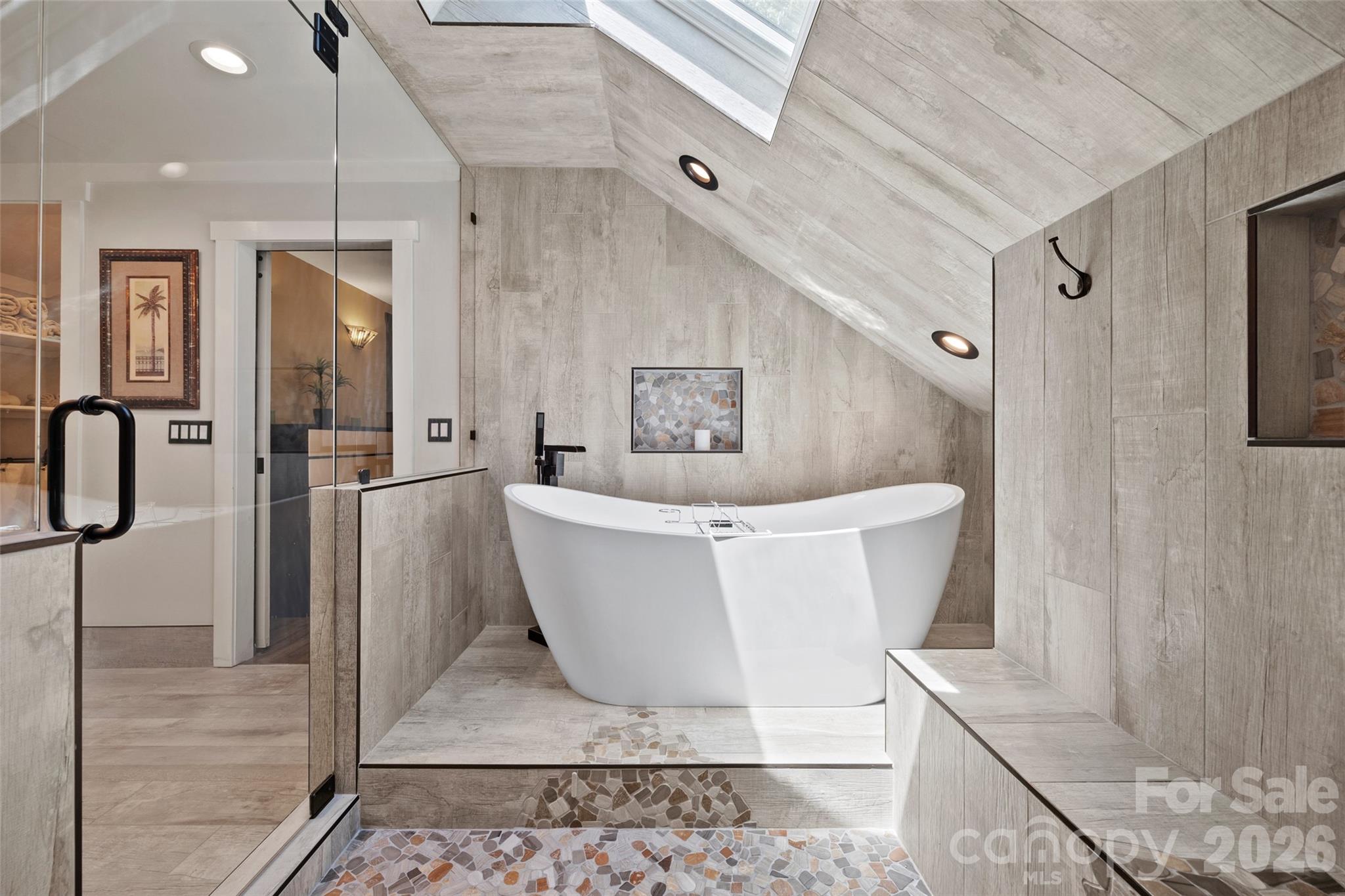 27056 Catamaran Drive Tega Cay, SC 29708 - Photo 23 of 48 a white bath tub sitting in a bathroom