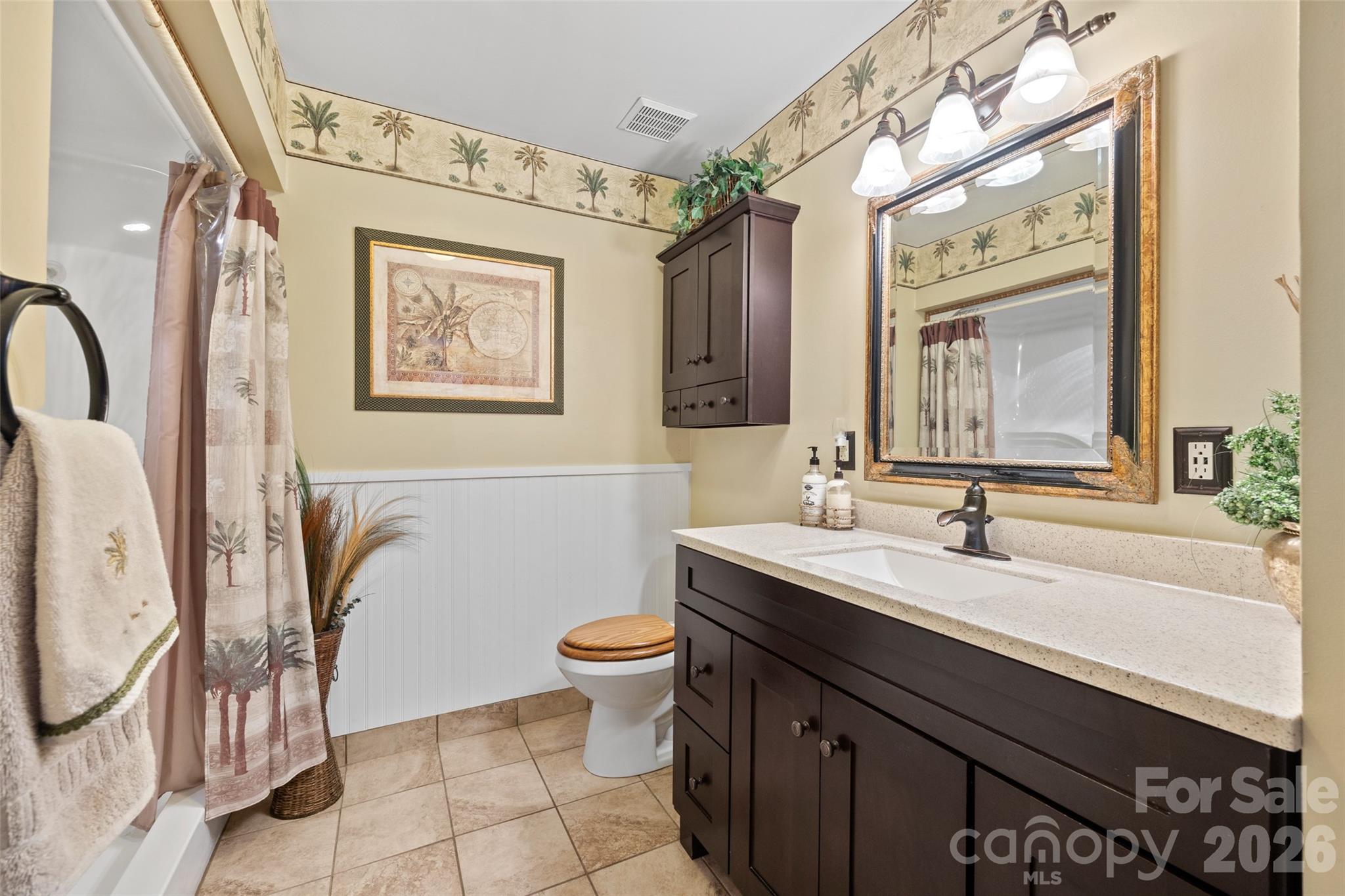 27056 Catamaran Drive Tega Cay, SC 29708 - Photo 33 of 48 a bathroom with a sink a toilet and mirror