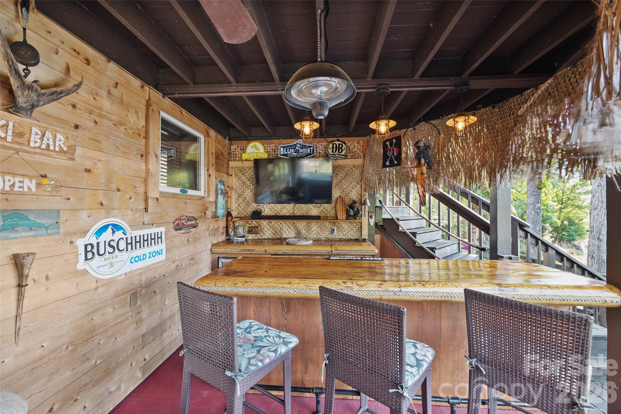 27056 Catamaran Drive Tega Cay, SC 29708 - Photo 37 of 48 a room with a table chairs and a chandelier