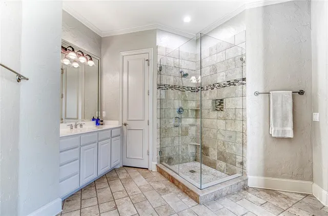 a bathroom with a shower sink and mirror