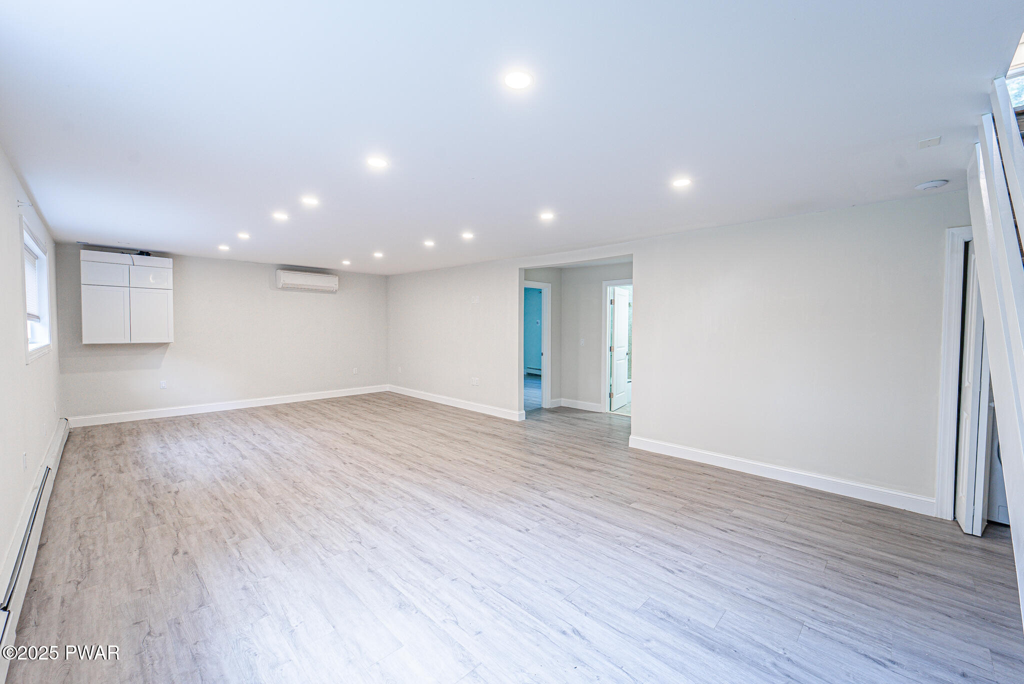 153 Hatton Road Hawley, PA 18428 - Photo 22 of 38 a view of an empty room with wooden floor and a window