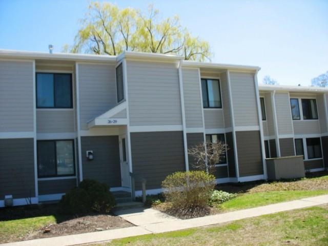 28 Olcott Way, Unit 28 Ridgefield, CT 06877 - Photo 1 of 1 a front view of a house with garden