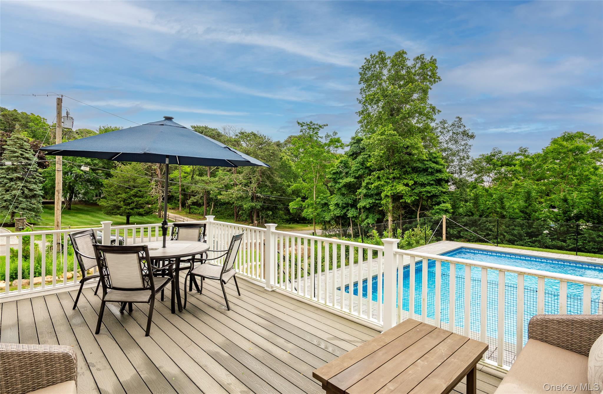 a view of a chairs and table on the deck