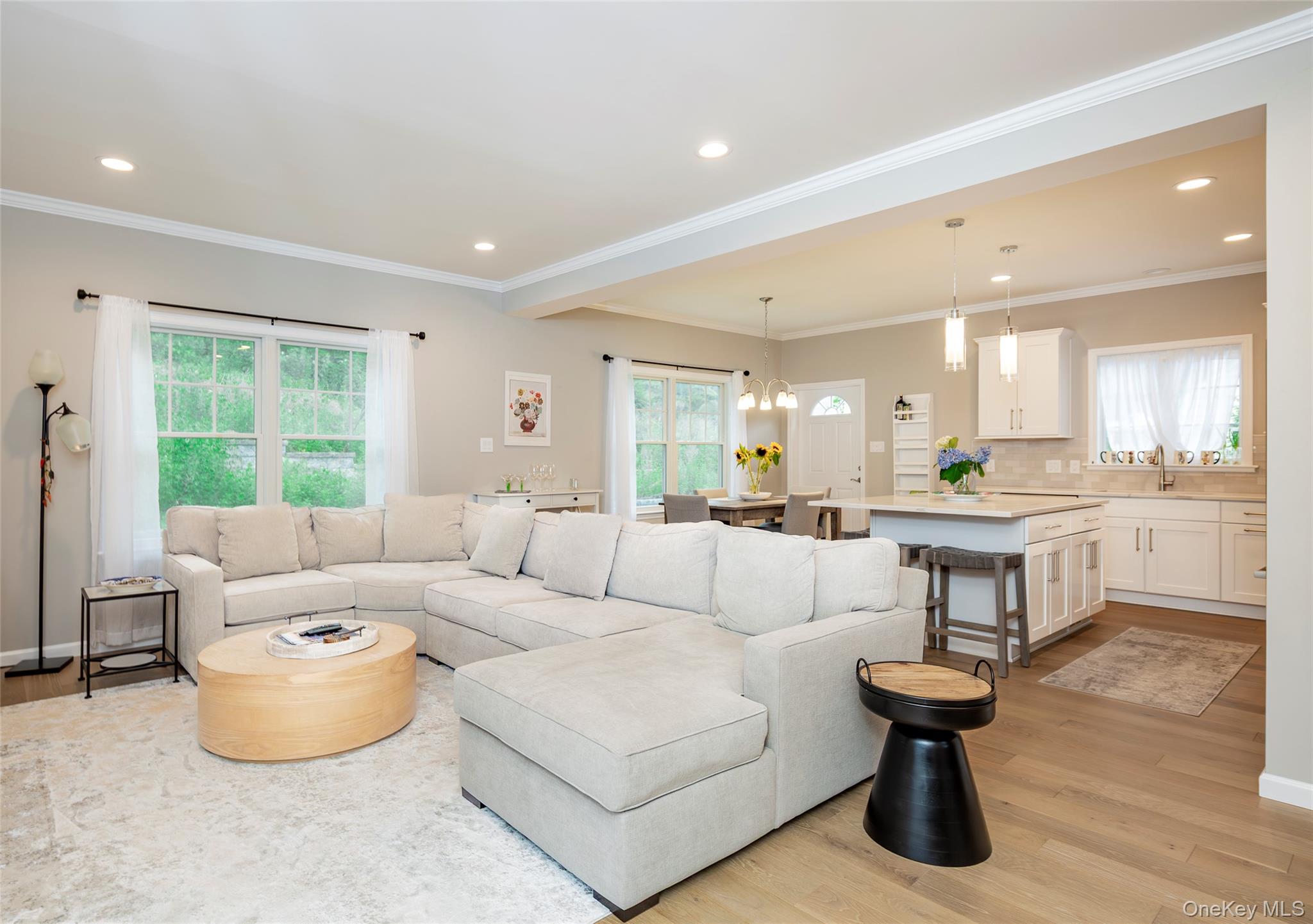 15 South Beach Road Southampton, NY 11968 - Photo 12 of 28 a living room with furniture and a large window