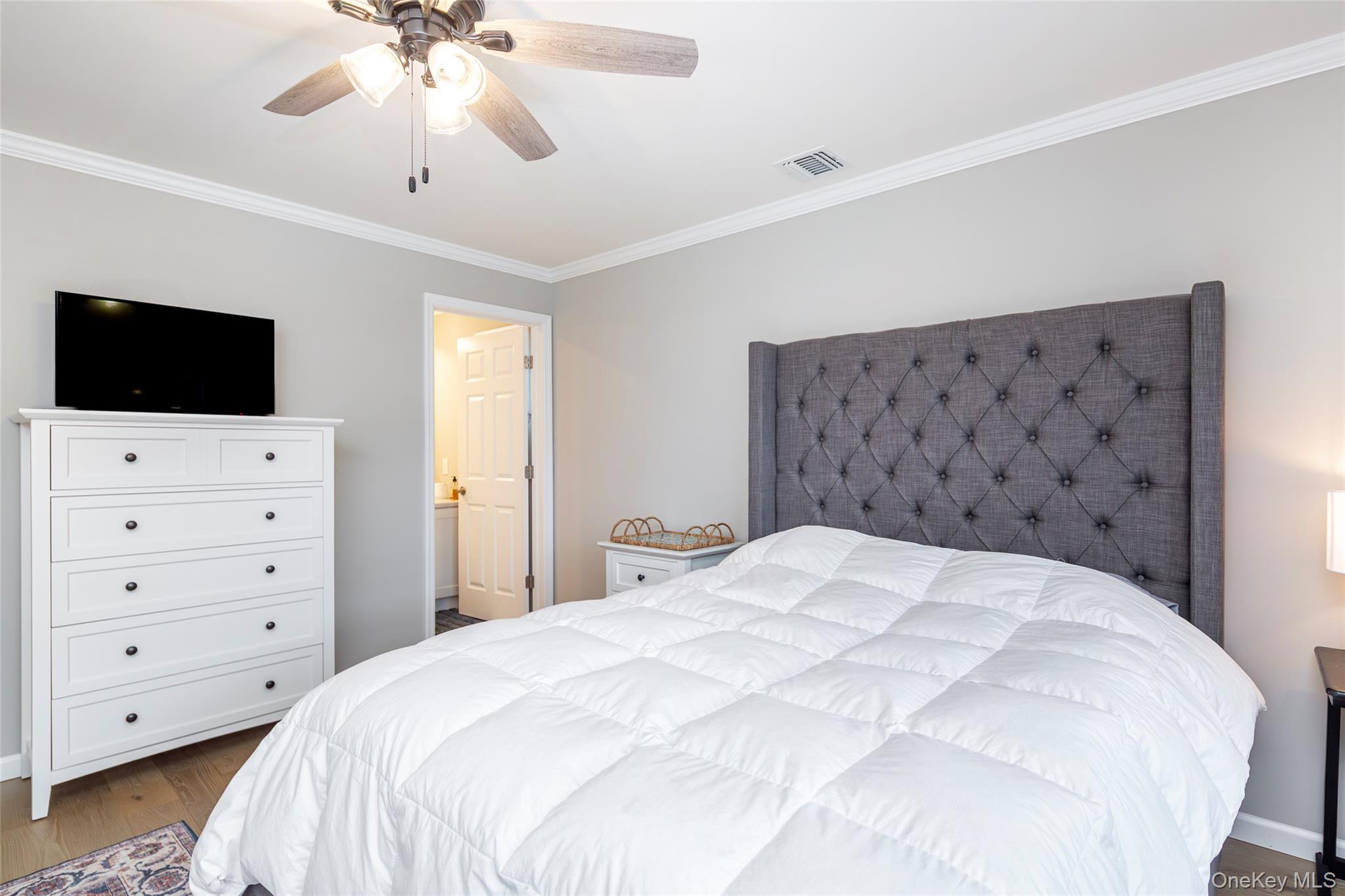 15 South Beach Road Southampton, NY 11968 - Photo 23 of 28 a large white bed in a bedroom