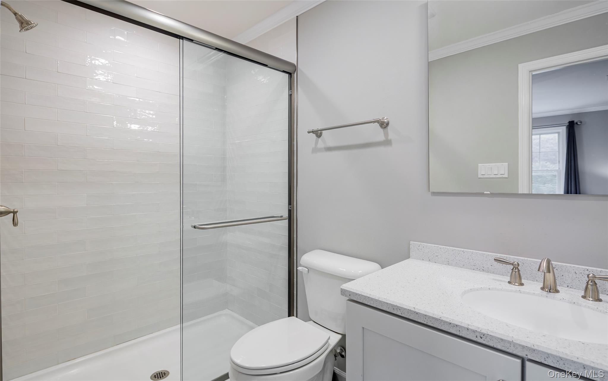 15 South Beach Road Southampton, NY 11968 - Photo 24 of 28 a bathroom with a sink a toilet and shower