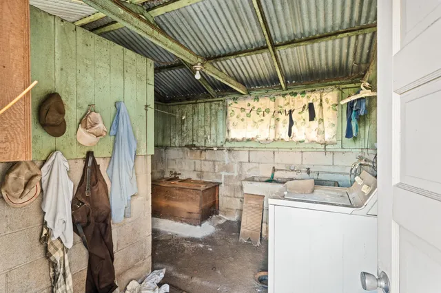 a view of a kitchen with a sink cabinets and a window