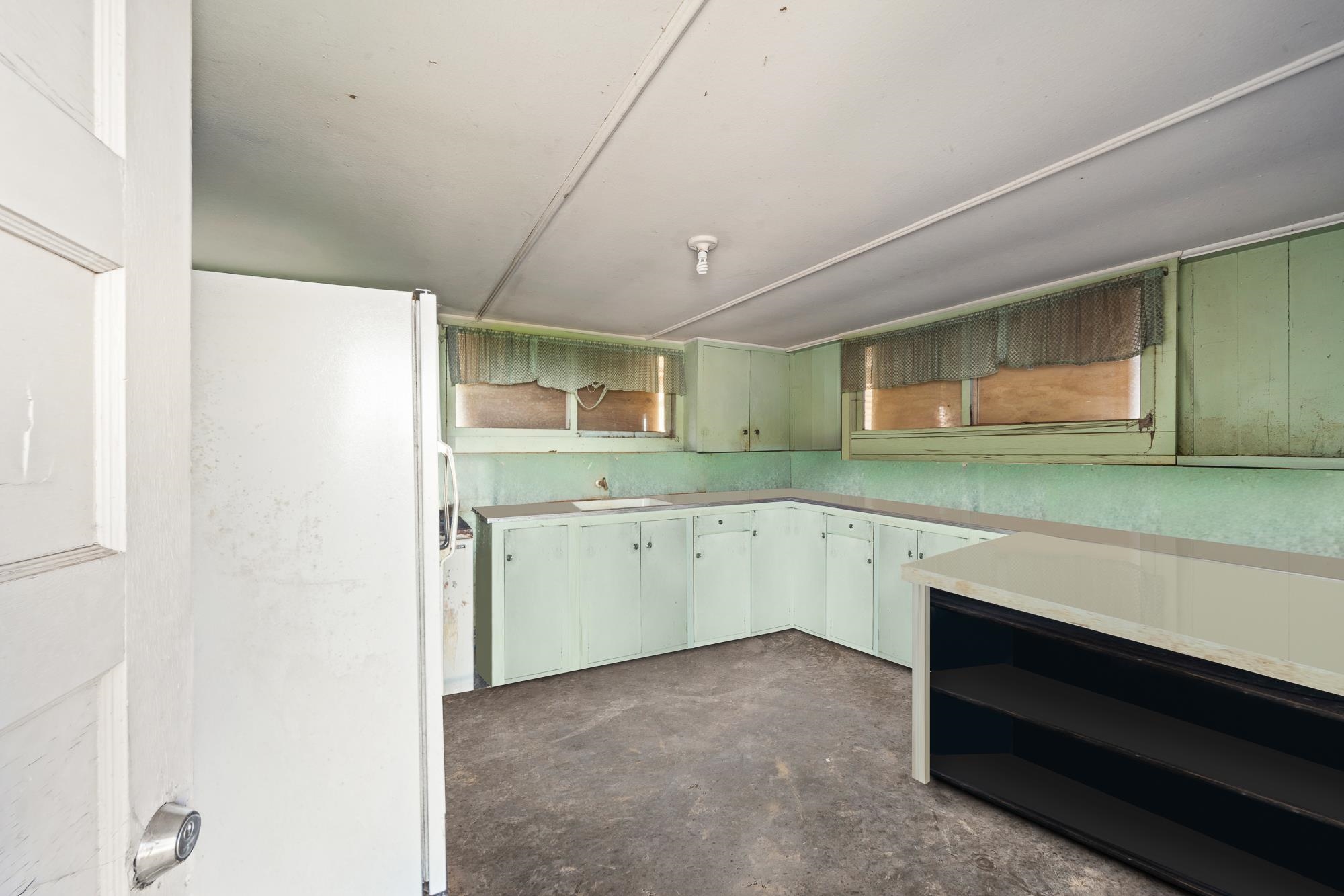 1375 Copp Road Kula, HI 96790 - Photo 23 of 35 a view of a kitchen with a sink cabinets and a window