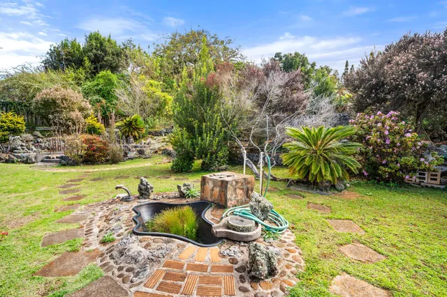a view of a yard with swimming pool