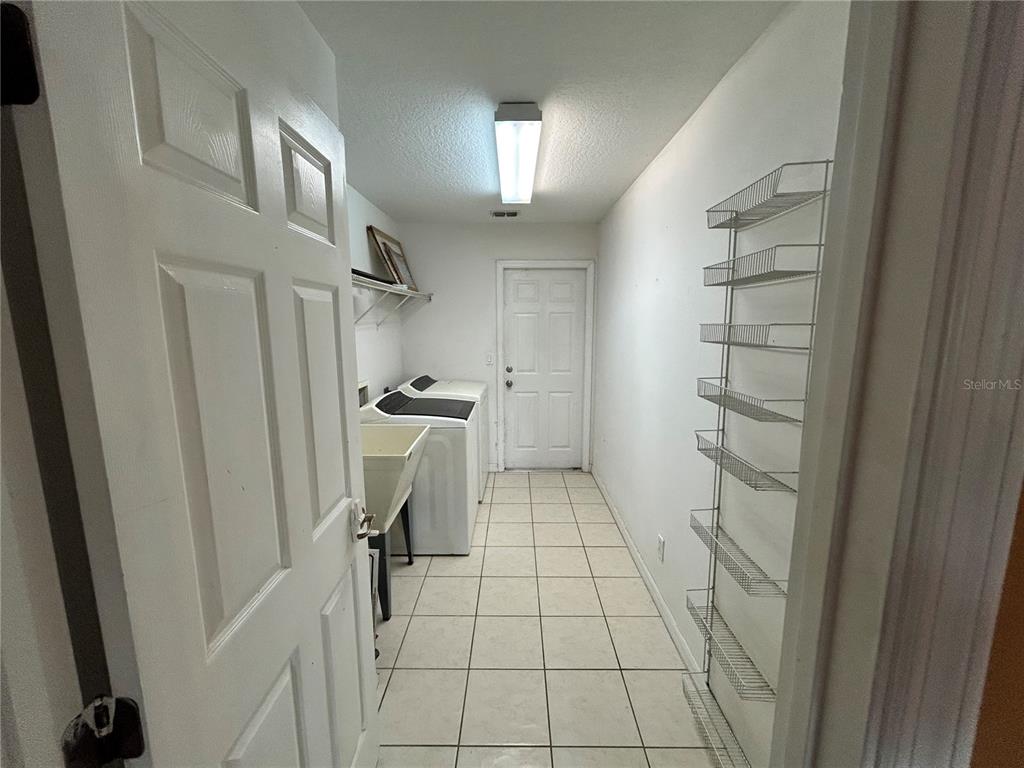 4475 Southwest 115th Street Ocala, FL 34476 - Photo 14 of 35 a view of walk in closet with empty racks