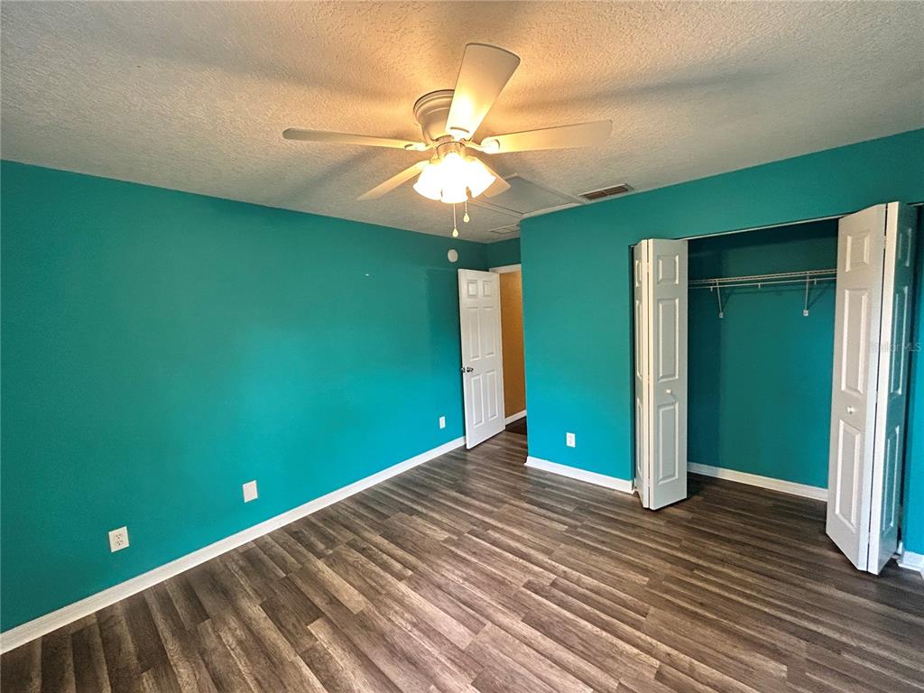 4475 Southwest 115th Street Ocala, FL 34476 - Photo 25 of 35 a view of an empty room with window and fan