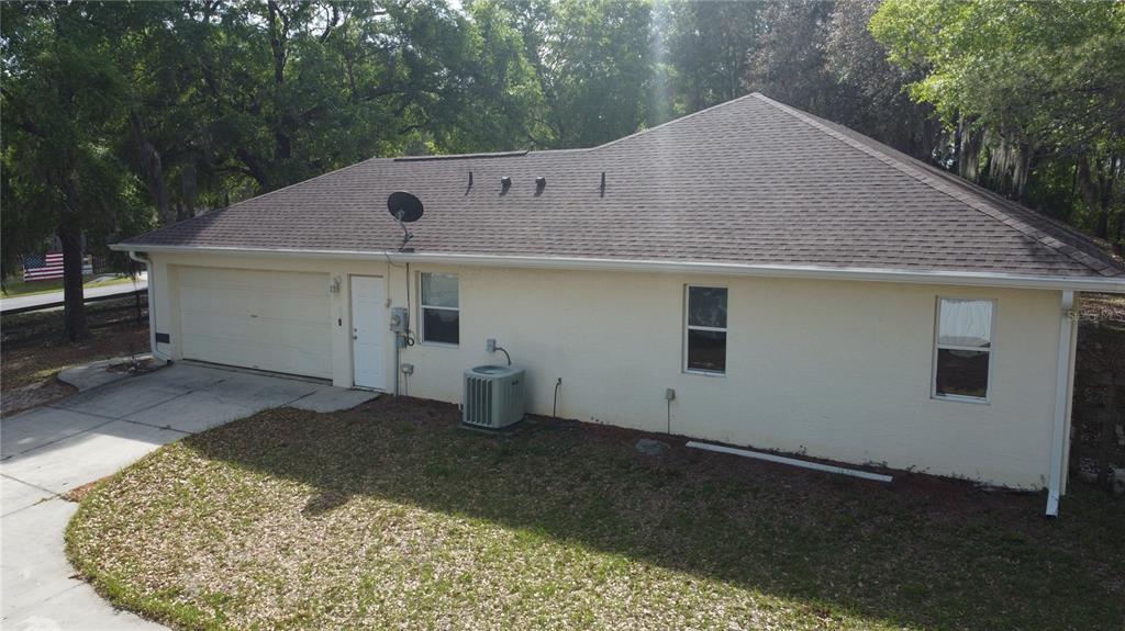 4475 Southwest 115th Street Ocala, FL 34476 - Photo 31 of 35 a front view of a house with a yard