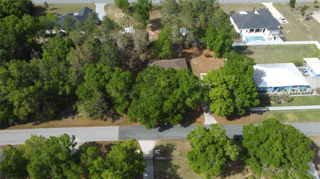 4475 Southwest 115th Street Ocala, FL 34476 - Photo 34 of 35 an aerial view of a house with a yard