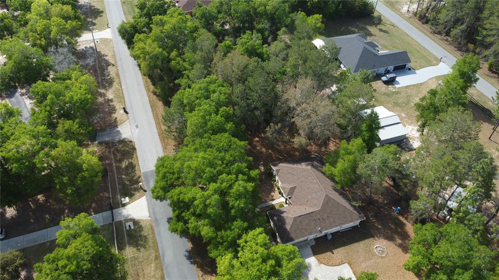 4475 Southwest 115th Street Ocala, FL 34476 - Photo 35 of 35 an aerial view of a house with a yard