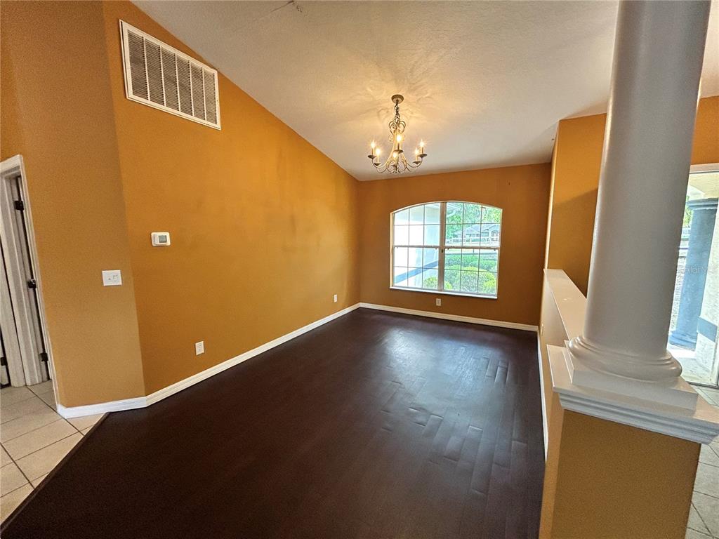 4475 Southwest 115th Street Ocala, FL 34476 - Photo 6 of 35 wooden floor in an empty room with a window