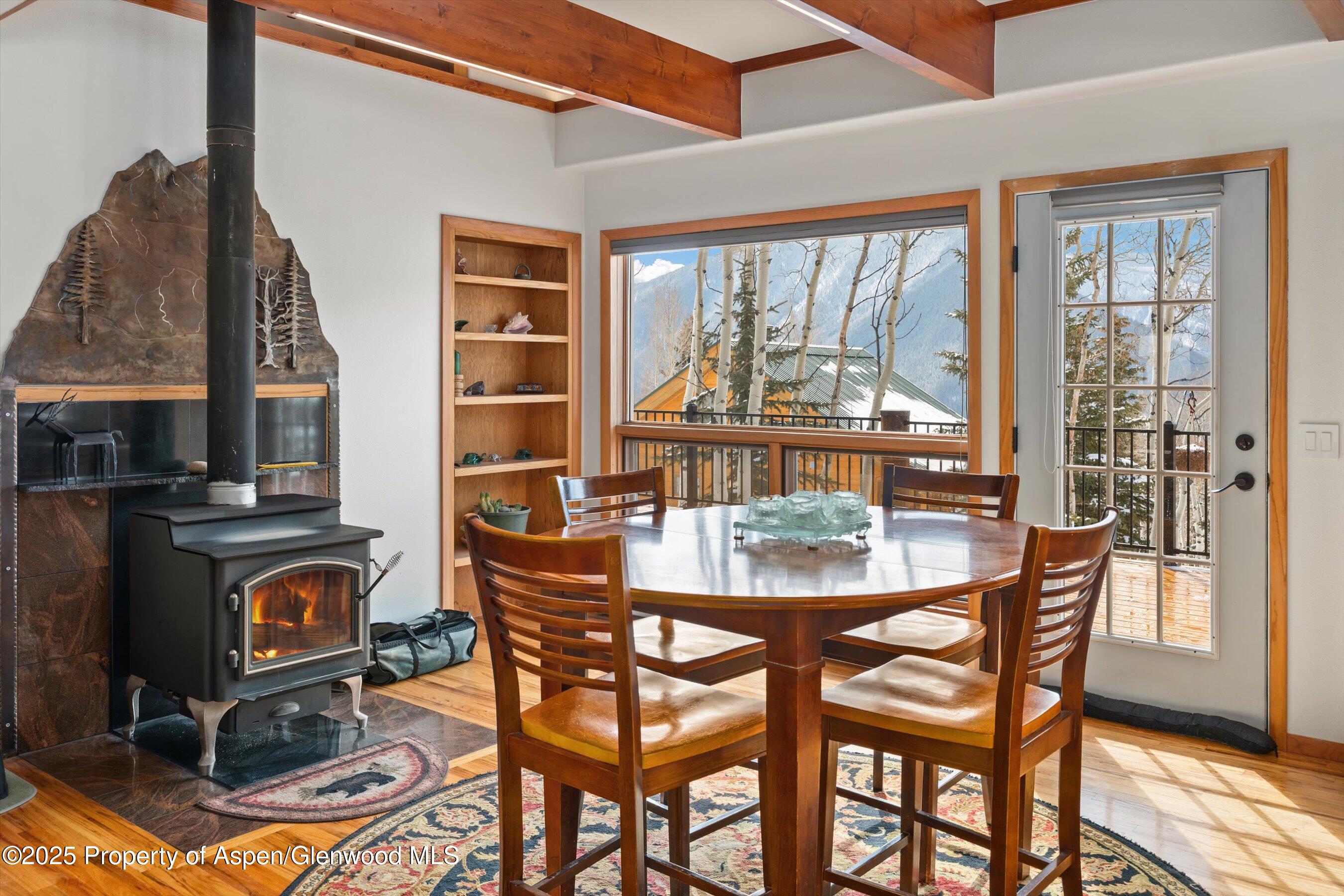 238 Hawk Lane Basalt, CO 81621 - Photo 19 of 46 a dining room with furniture a floor to ceiling window and outside view