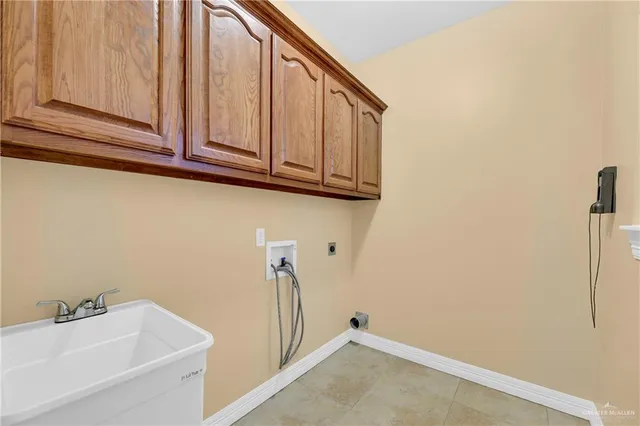 a bathroom with a sink and a shower curtain