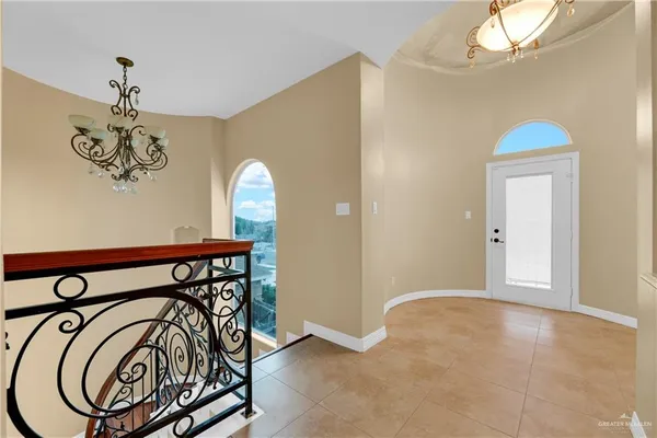 a view of a hallway with a chandelier