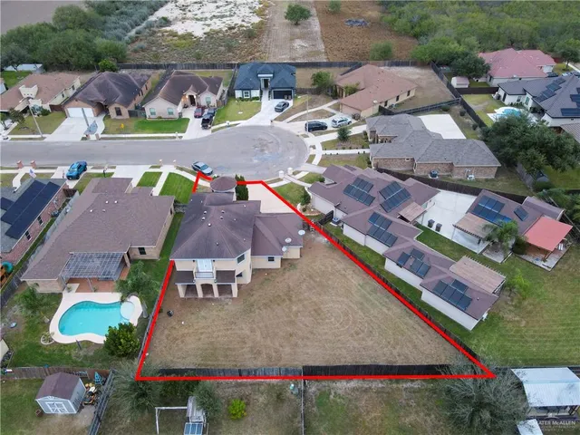 an aerial view of residential houses and outdoor space