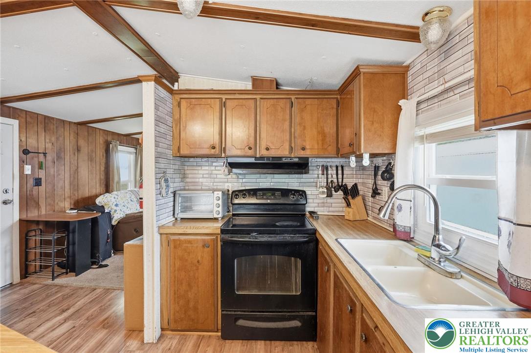3101 Newburg Road Nazareth, PA 18064 - Photo 7 of 23 a kitchen with stainless steel appliances a stove sink and cabinets