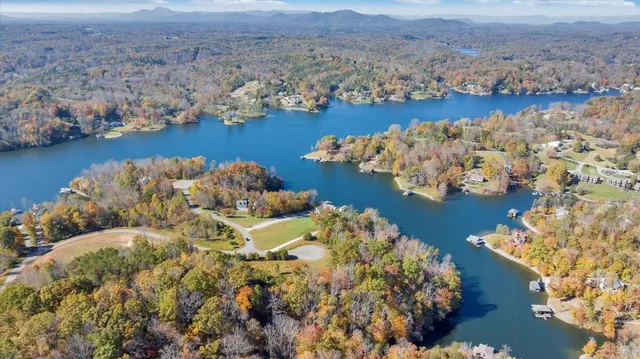 an aerial view of beach and residential houses with outdoor space