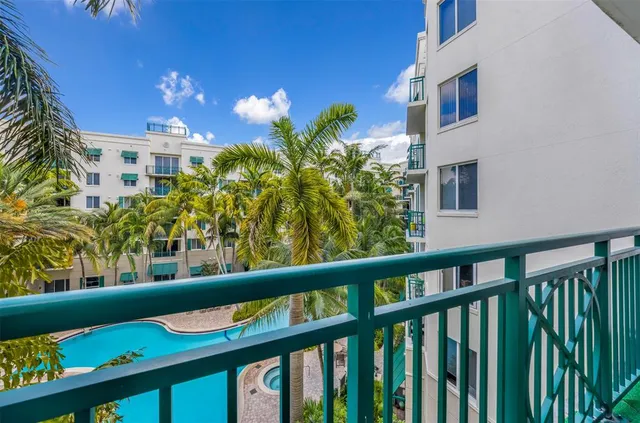 a view of a chairs and table in a balcony
