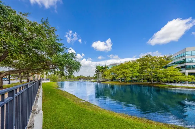 a view of a lake with a house in the background