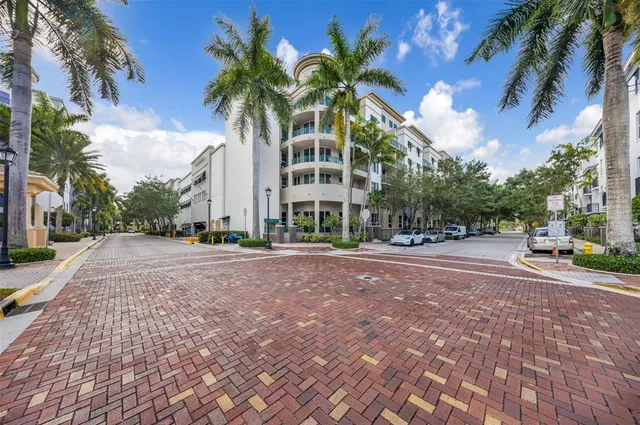 a view of a palm trees in front of a house