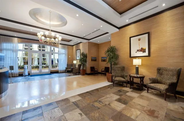 a lobby with furniture and dining table