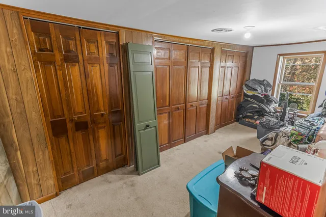 a view of a balcony with furniture and a window