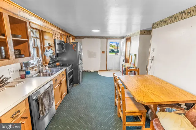 a spacious bathroom with a sink a bathtub and a window