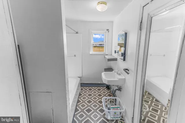 a bathroom with a sink and toilet