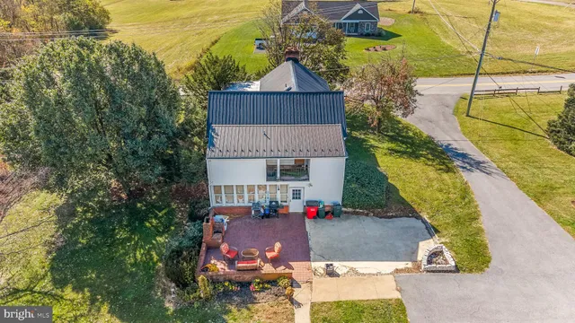 an aerial view of houses with outdoor space