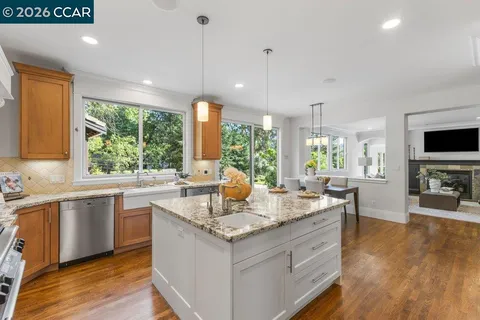 a utility room with sink dryer and washer
