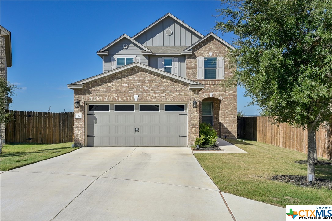 440 Los Cobos Lane Georgetown, TX 78626 - Photo 1 of 1 a front view of a house with yard and parking