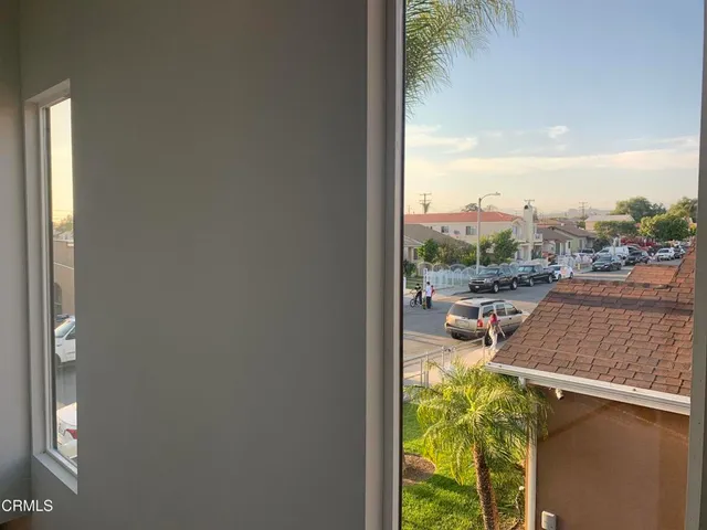 a view of a balcony with lake view and a potted plant