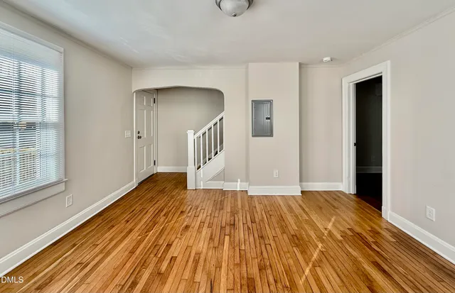 a view of an entryway with wooden floor